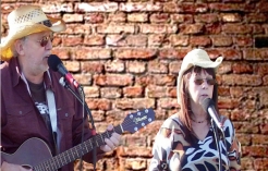 Papa and Mama Root in concert.